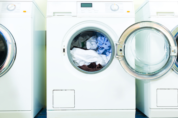 Canva Washing Machines in a Laundromat